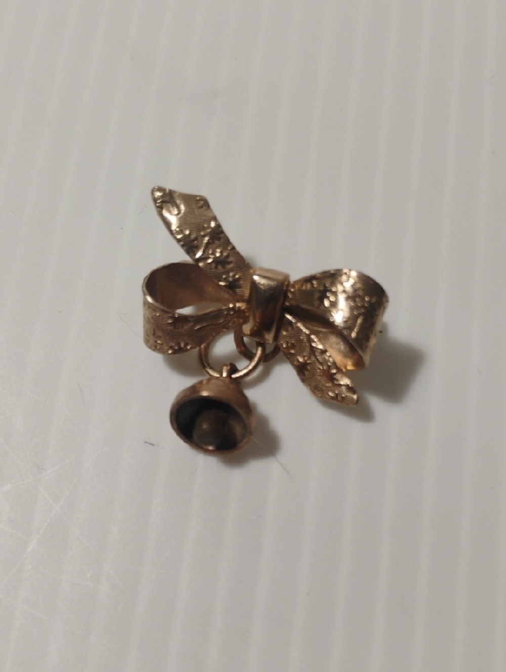 Vintage Golden Etched Bow Pendant With Bell